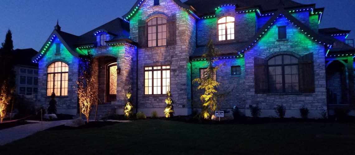 soffit lighting compliments landscape lighting for this stunning home